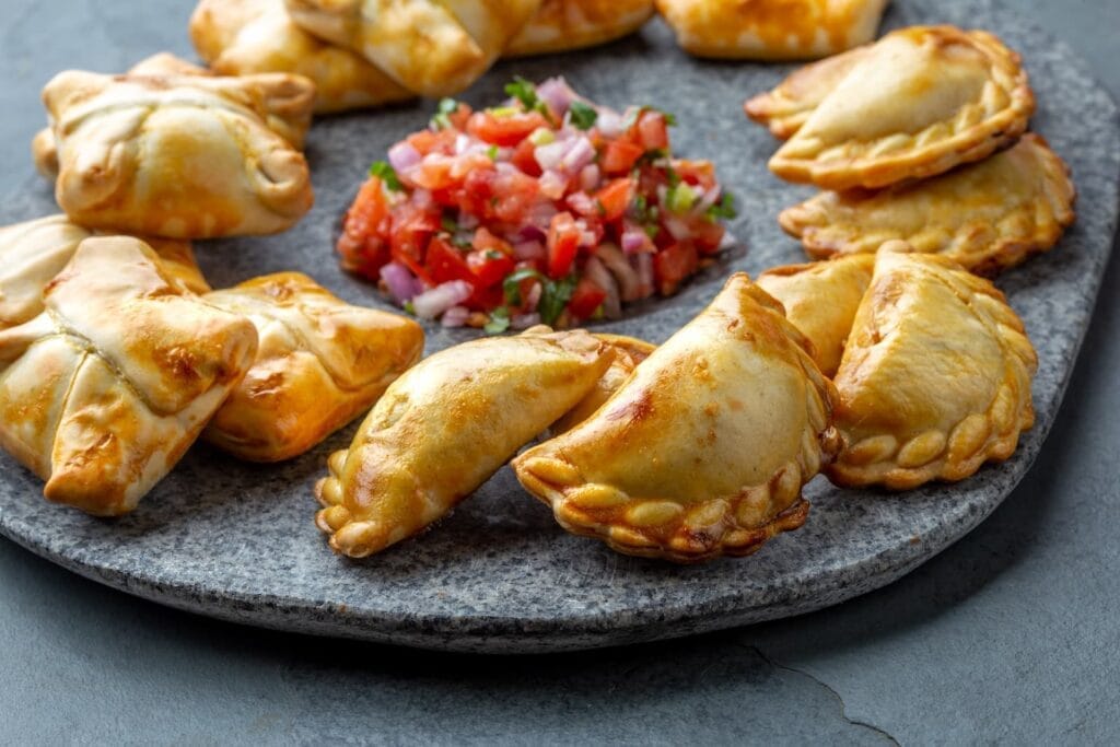 Golden baked empanadas served with fresh pico de gallo