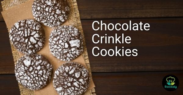Chocolate crinkle cookies dusted in powdered sugar beside the words “Chocolate Crinkle Cookies”