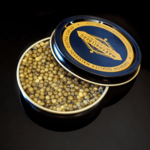 Open tin of golden osetra caviar beside its Marshallberg Farm malossol lid