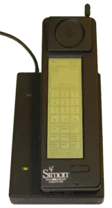 The IBM Simon Personal Communicator, the first smartphone, resting in its charging dock