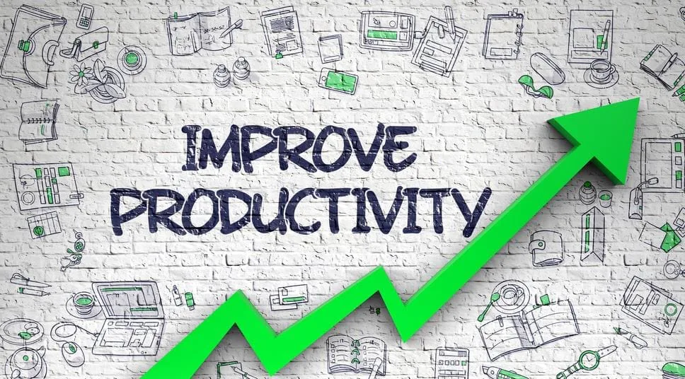 The words Improve Productivity on white brick with a green arrow rising through doodled icons