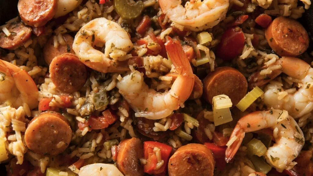 Close-up of Louisiana jambalaya with shrimp, sliced andouille sausage, rice and peppers