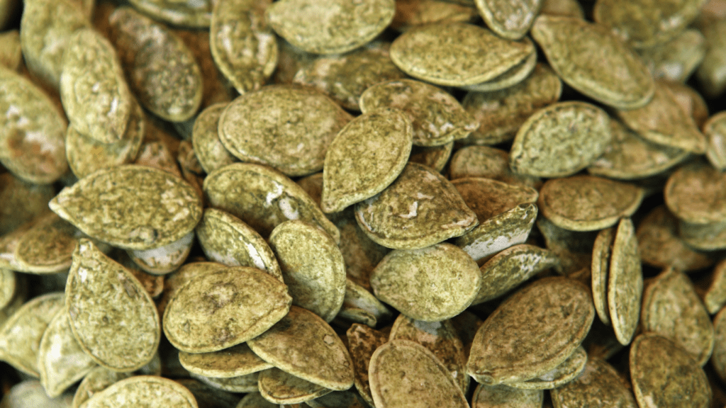 Close-up of a pile of green pumpkin seeds, or pepitas