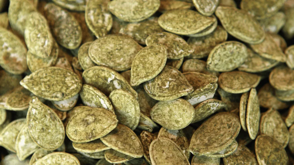 Close-up of a pile of green pumpkin seeds, or pepitas