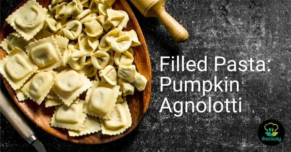 Filled Pasta: Pumpkin Agnolotti workshop banner with fresh agnolotti on a wooden board
