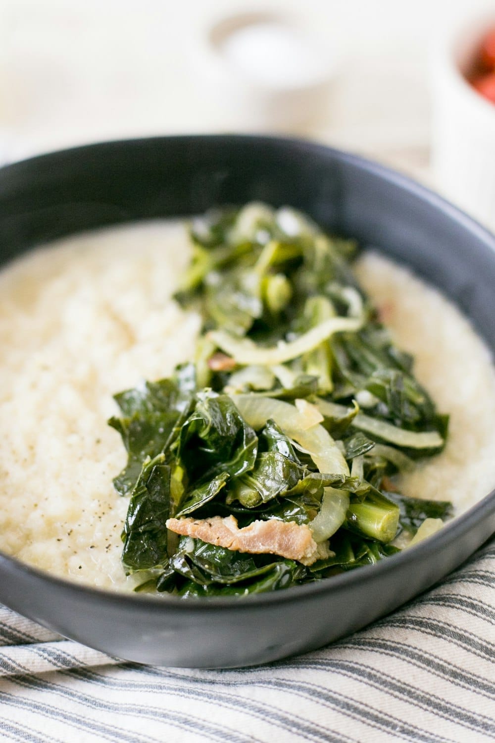 Southern grits bowl with collard greens and salmon