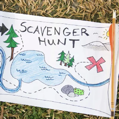 Hand-drawn scavenger hunt map with pine trees, a dotted trail and an X marking the spot