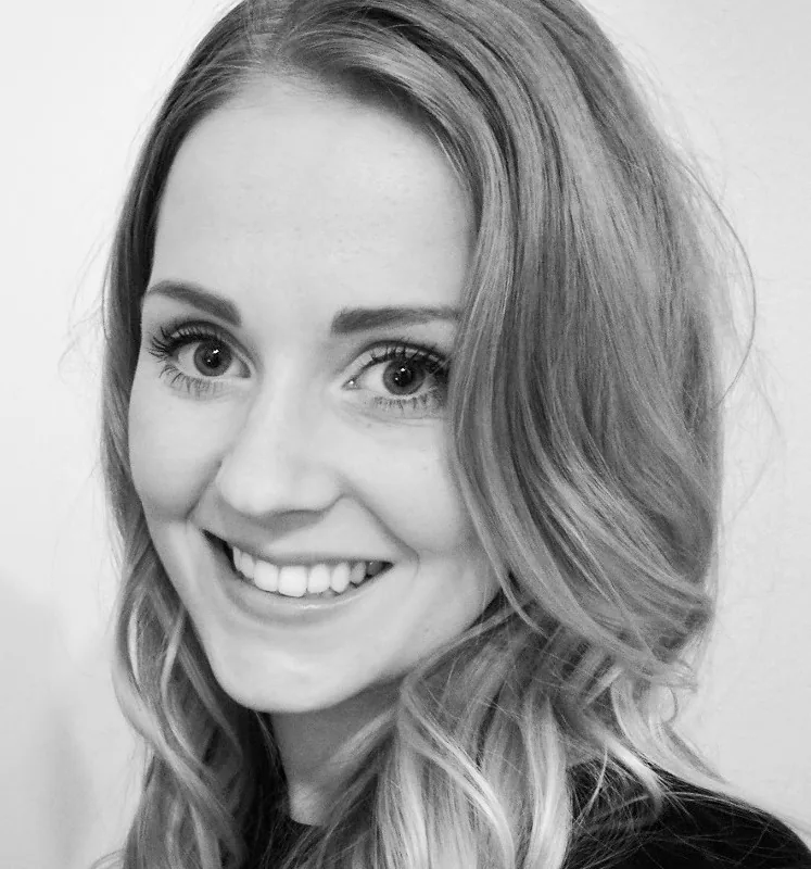 Leslie Schwarz, Rockoly co-founder and COO, smiling in a black-and-white portrait