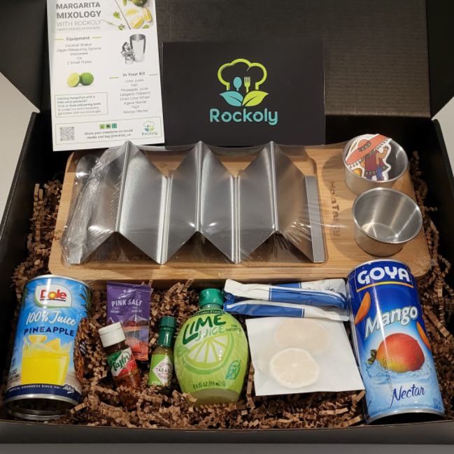 Margarita mixology kit in a Rockoly box with shakers, pineapple and lime juice, salt and a recipe card