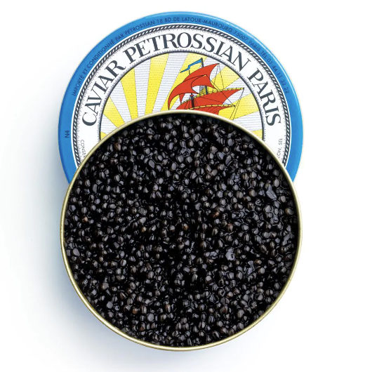 Tin of glossy black caviar with its blue lid reading Caviar Petrossian Paris