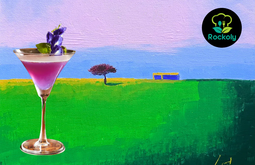 Purple cocktail in a martini glass garnished with a flower, set against a painted landscape