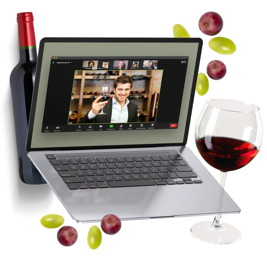 Laptop showing a sommelier raising a glass on a video call, with a wine bottle, red wine and grapes