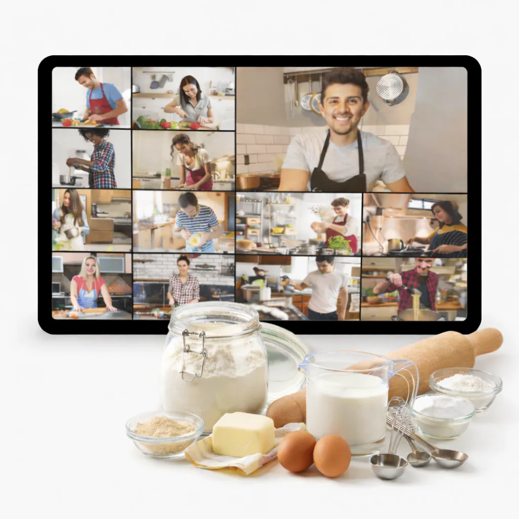 Screen showing a grid of home bakers on a video class beside flour, milk, butter, eggs and a rolling pin