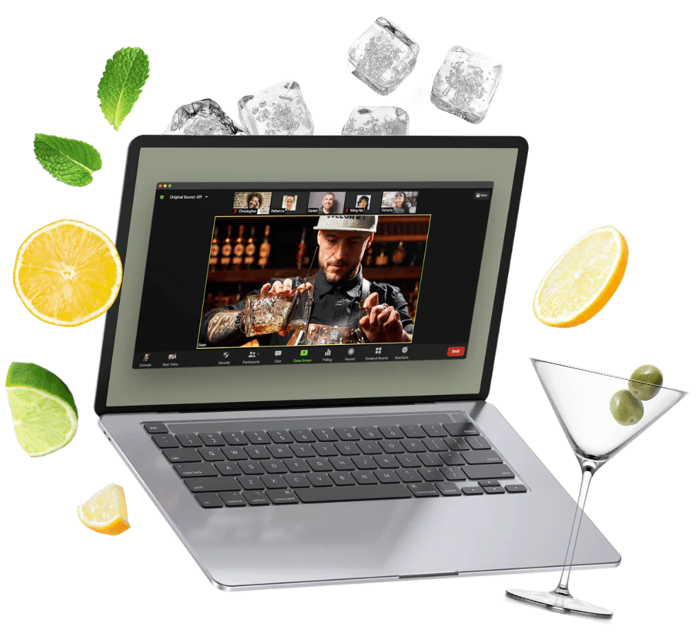 Laptop on a video call with a mixologist and guests, ringed by citrus, mint, ice cubes and a martini