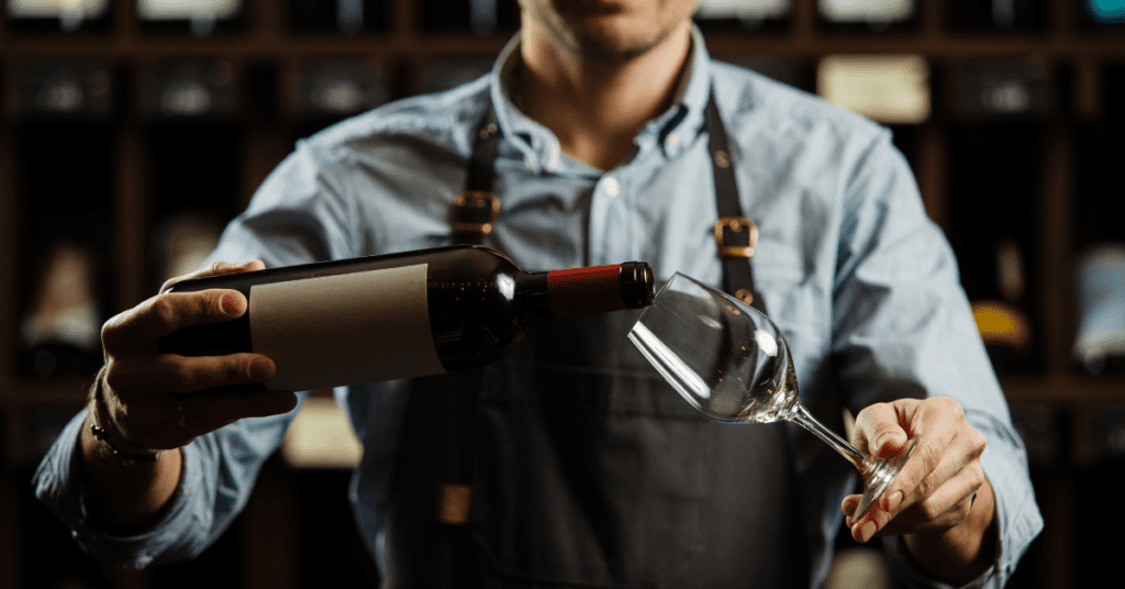 Sommelier pouring red wine from Spain into a wine glass