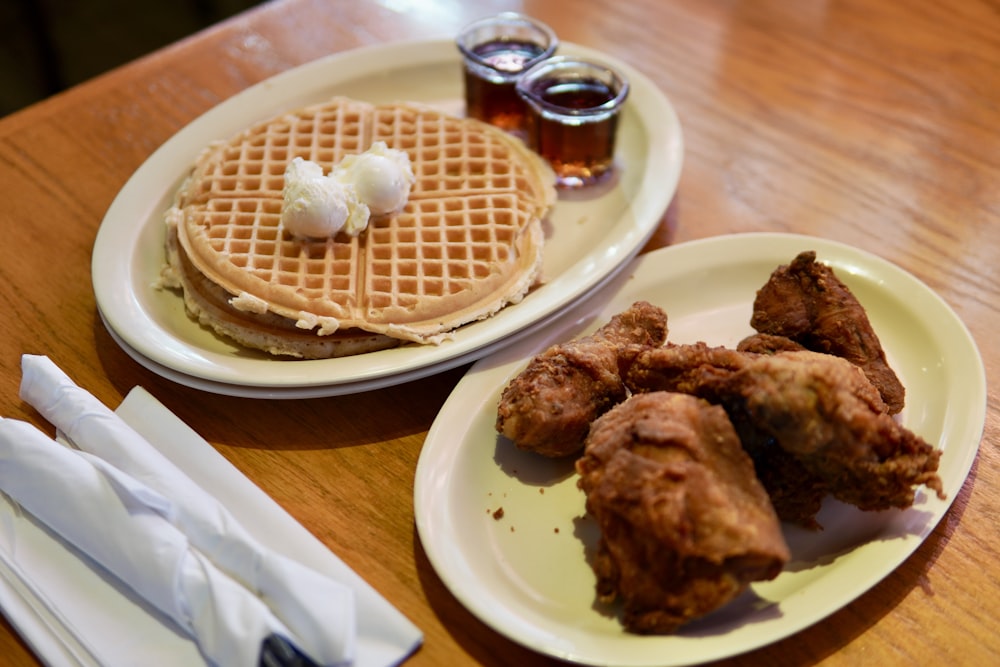 Classic soul food chicken and waffles with maple syrup